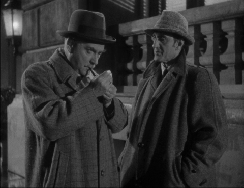 Nigel Bruce as Doctor Watson and Basil Rathbone as Sherlock Holmes in Dressed to Kill (1946)