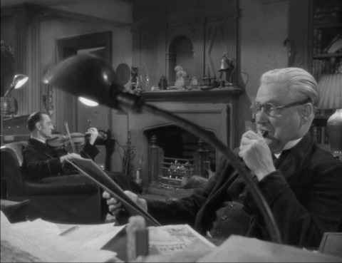 Basil Rathbone as Sherlock Holmes and Nigel Bruce as Doctor Watson in Dressed to Kill (1946)